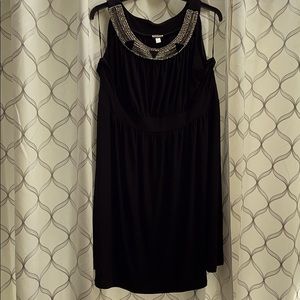 formal black dress with statement neckline